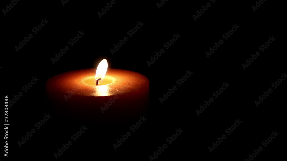Candle on a black background