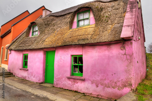 Pink cottage house in Doolin, Co. Clare, Ireland photo