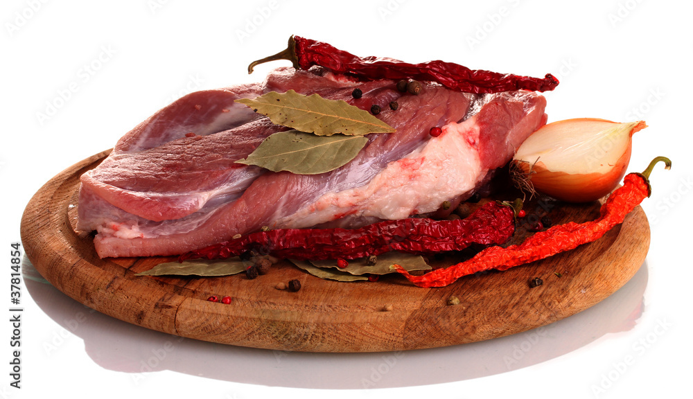 Raw meat and vegetables on a wooden board isolated on whitе Raw meat and vegetables on a wooden board isolated on whitе
