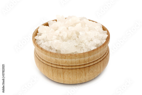 Sea salt in a wooden tableware close-up