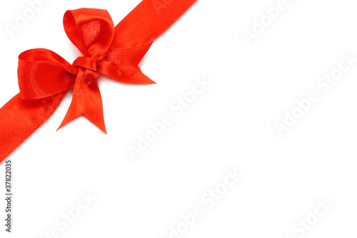 Big red holiday bow on white background