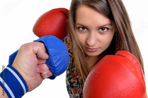 Young beautiful woman during fitness time and boxing photo