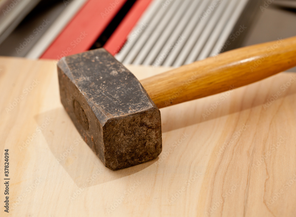 Large lump hammer on workbench