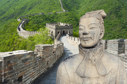 Ancient Chinese terracotta warrior against Great Wall background