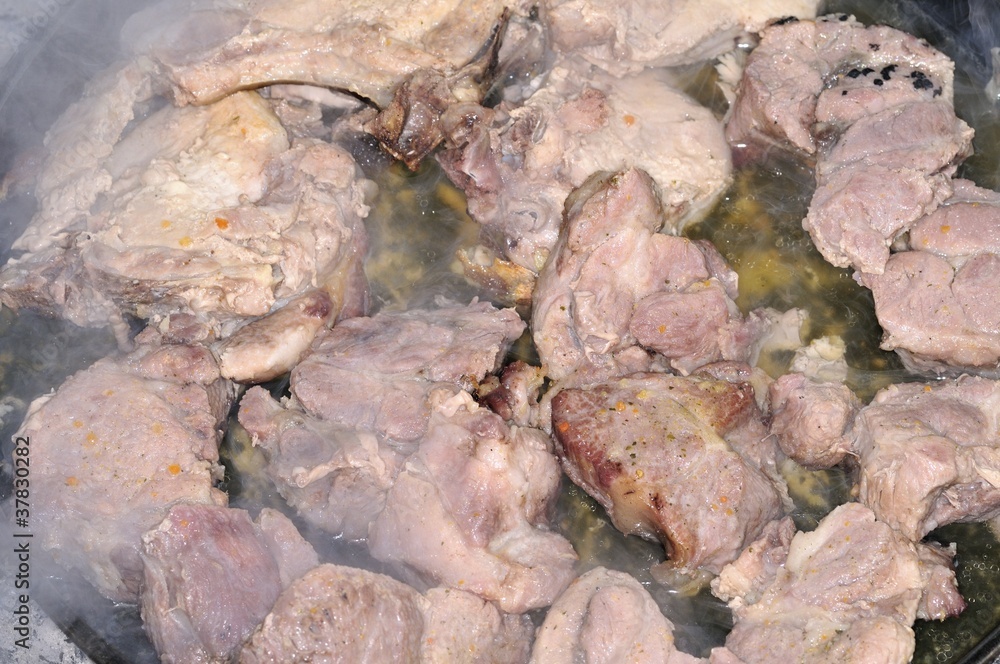Delicious pork roasted an open fire Delicious pork roasted an open fire
