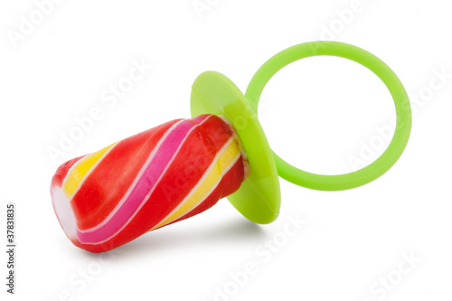 Colorful candy in a baby pacifier photo