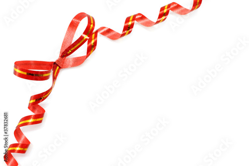 Red holiday bow on white background