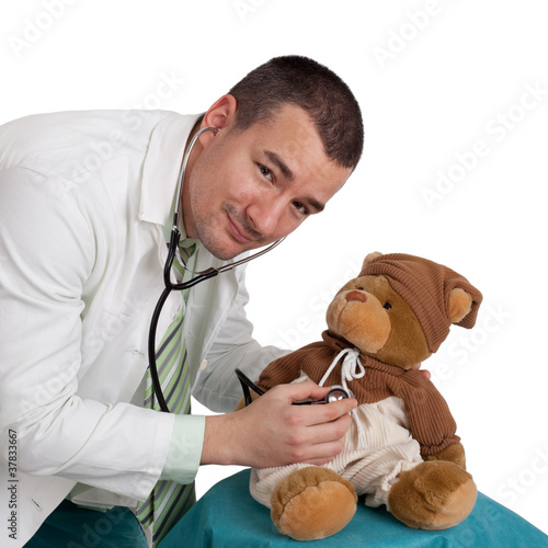 Male pediatrician and teddy bear photo