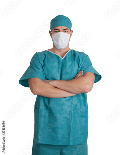 Doctor in scrubs with hands folded.