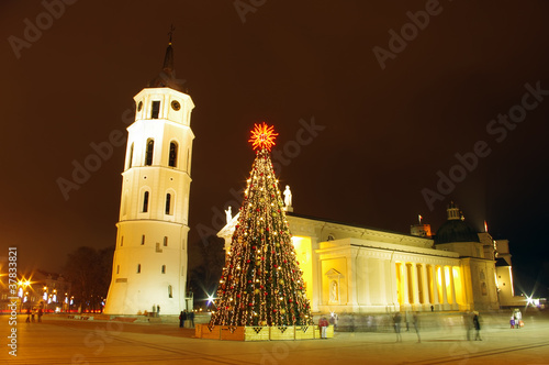 Night view of the christmas tree and bell tower on a Cathedral s photo