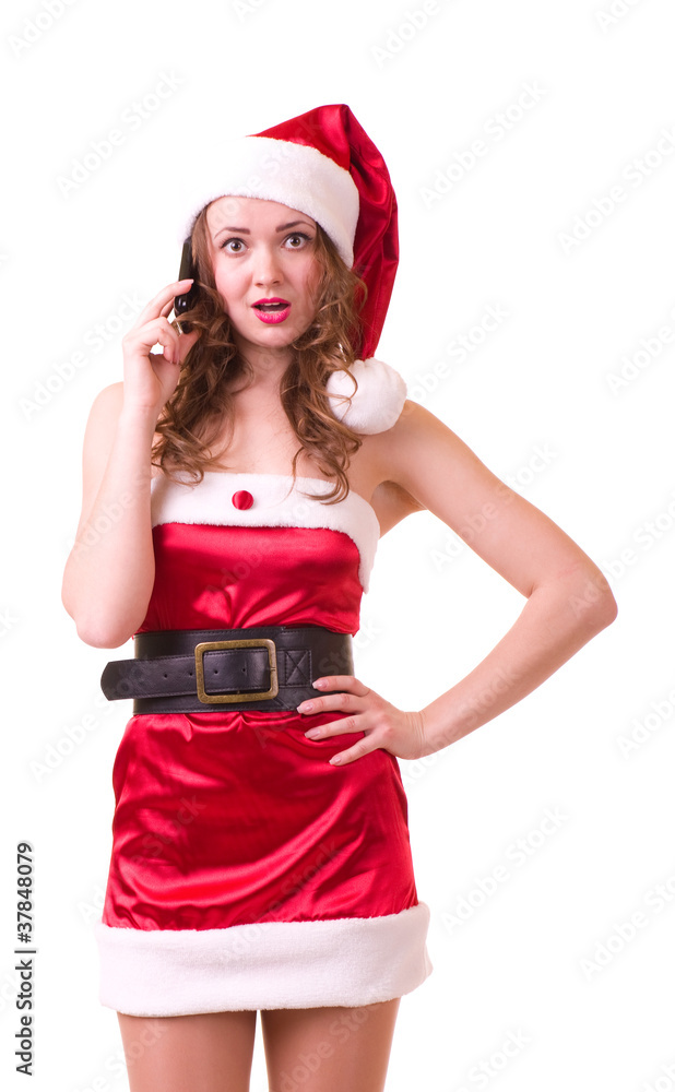 Beautiful young woman in Santa Claus clothes with telephone Beautiful young woman in Santa Claus clothes with telephone