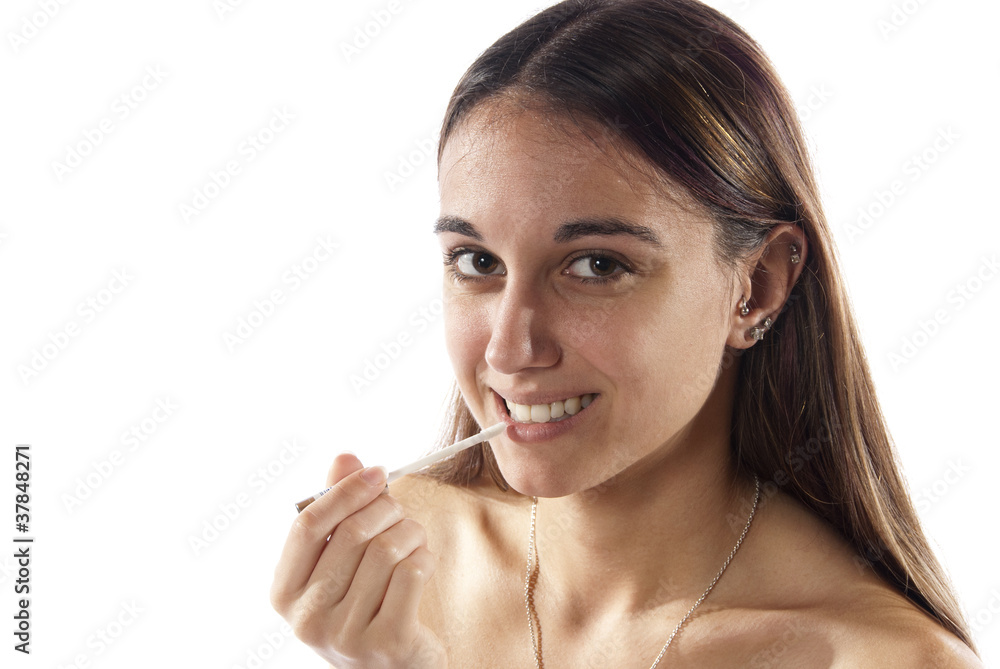 Woman putting on make-up cosmetic's lip gloss Woman putting on make-up cosmetic's lip gloss