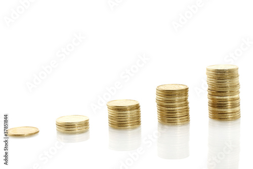 Stacks of coins on white background