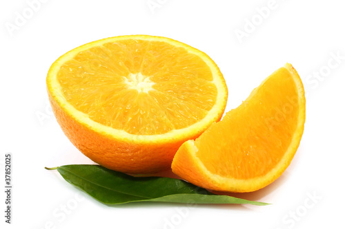 Cut orange with leaf on white background