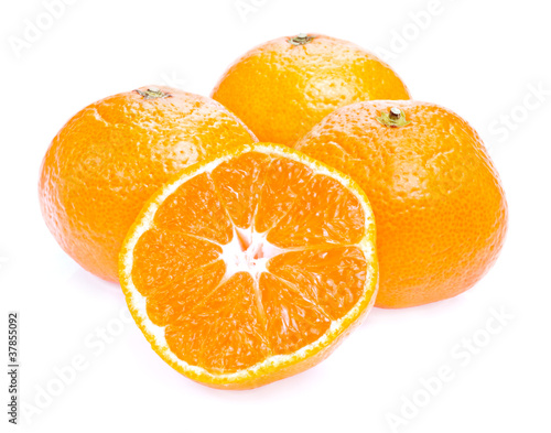 Fototapeta Naklejka Na Ścianę i Meble -  Three ripe juicy Tangerine and half Isolated on white background