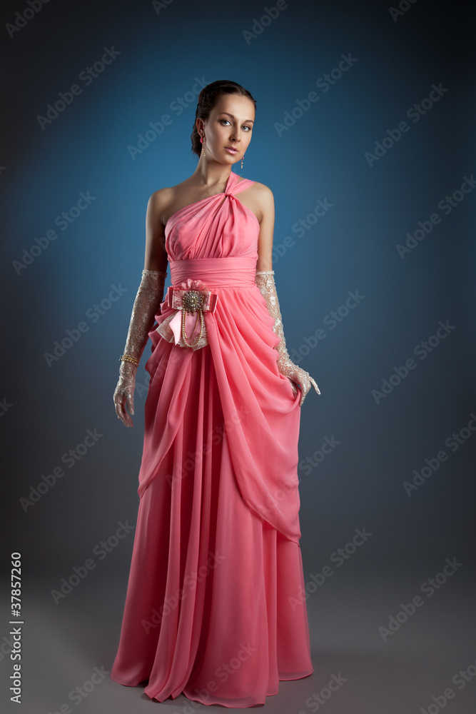 Young fashion woman posing in evening cloth