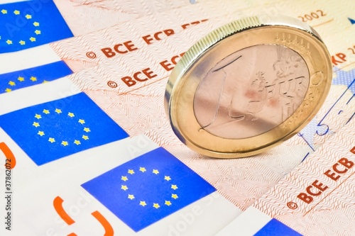 euro coin on 50-euro banknotes photo