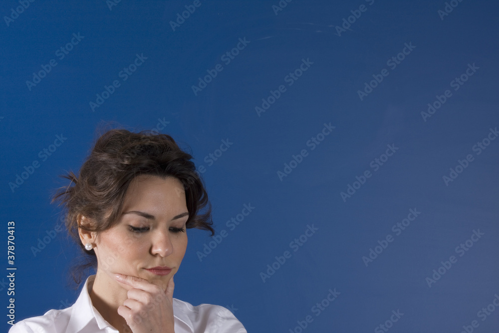 Image of young woman thinking on green board Image of young woman thinking on green board