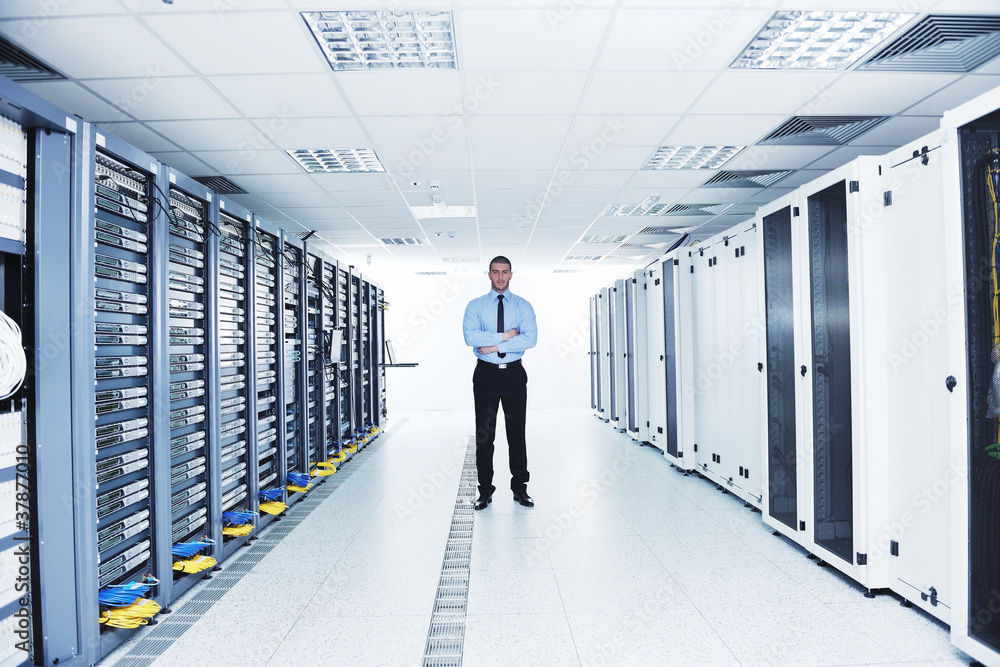 Fototapeta premium young it engeneer in datacenter server room
