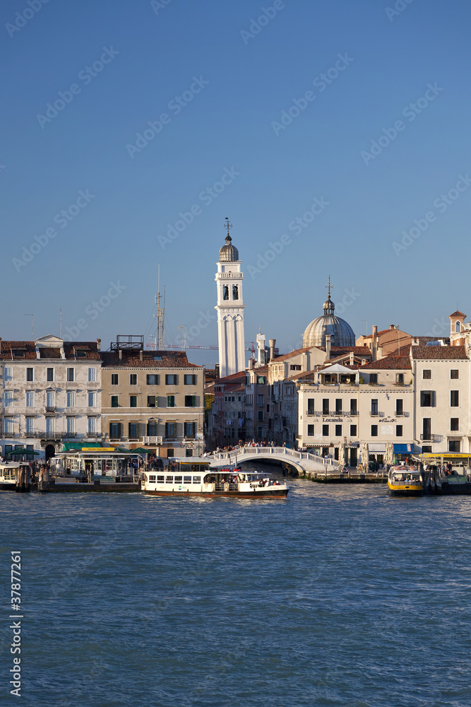 venice canal with leaning tower