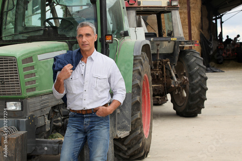 farmer posing near tractors © auremar