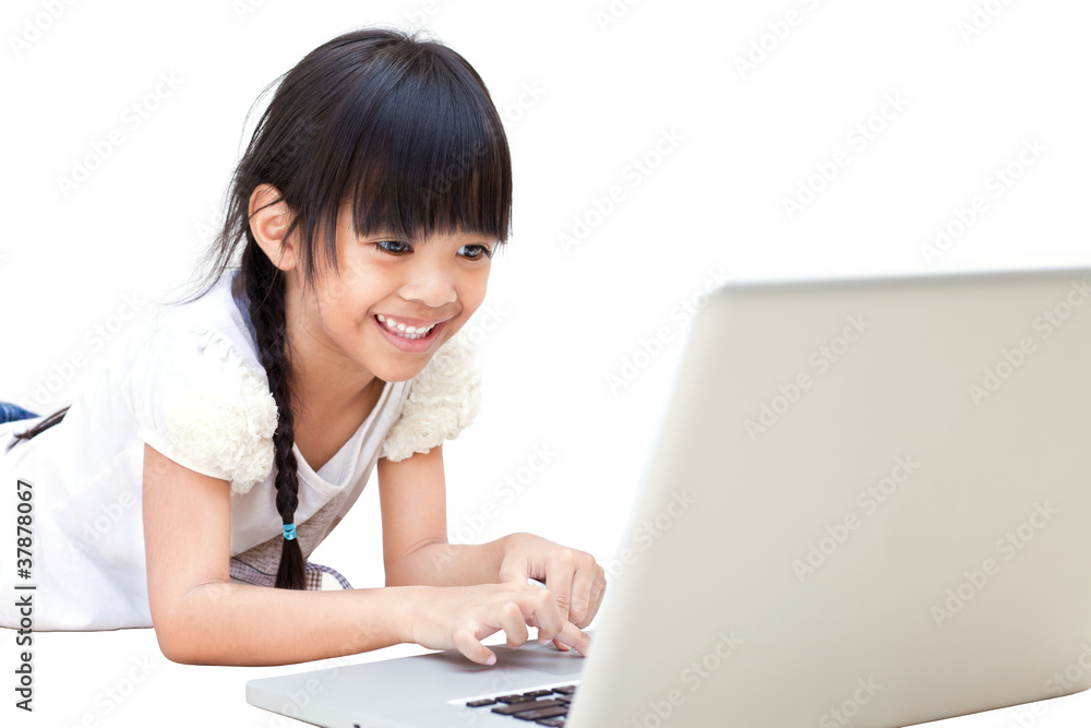 Happy and smiling little girl with laptop isolated on white Happy and smiling little girl with laptop isolated on white