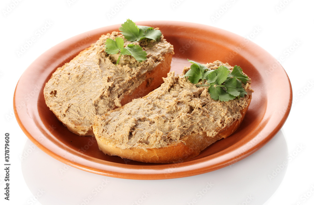 Fresh pate on bread on brown plate isolated on white