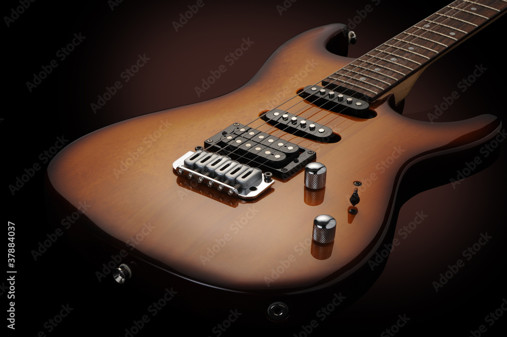 close up of a elelctric guitar on dark background close up of a elelctric guitar on dark background