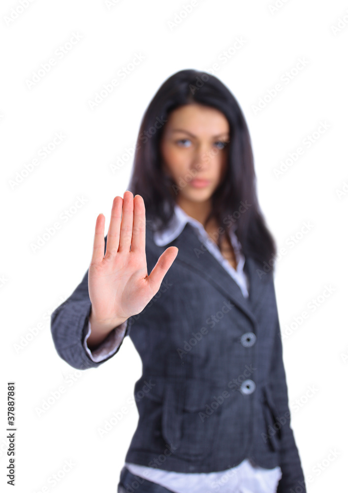 Serious business woman making stop sign over white Serious business woman making stop sign over white