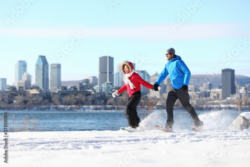 Couple snowshoeing in montreal photo