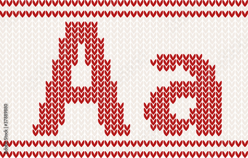 Red knitted Letter a on beige Background
