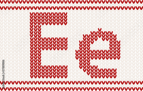 Red knitted Letter e on beige Background