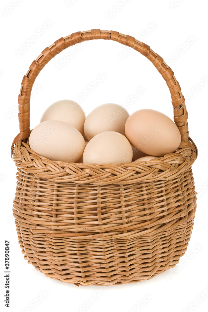 eggs and basket isolated on white