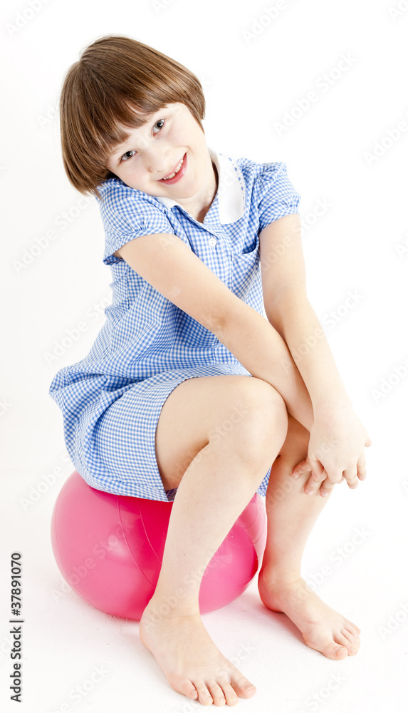 girl sitting on a ball girl sitting on a ball