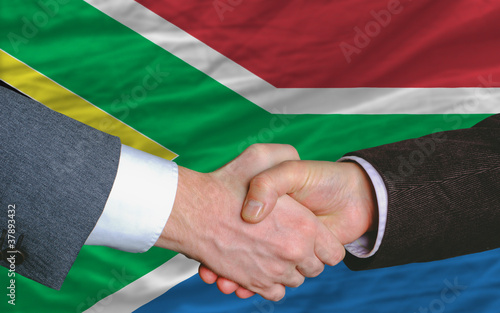 businessmen handshake after good deal in front of south africa f photo