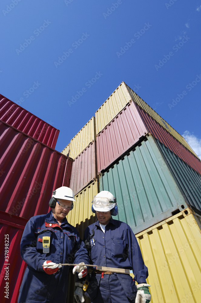 port workers and cargo containers port workers and cargo containers