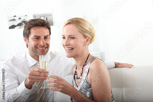 Couple drinking champagne at home