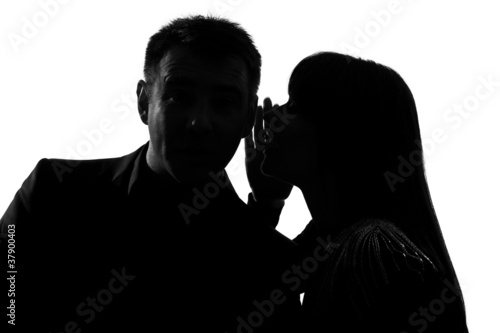 one couple man and woman whispering at ear photo