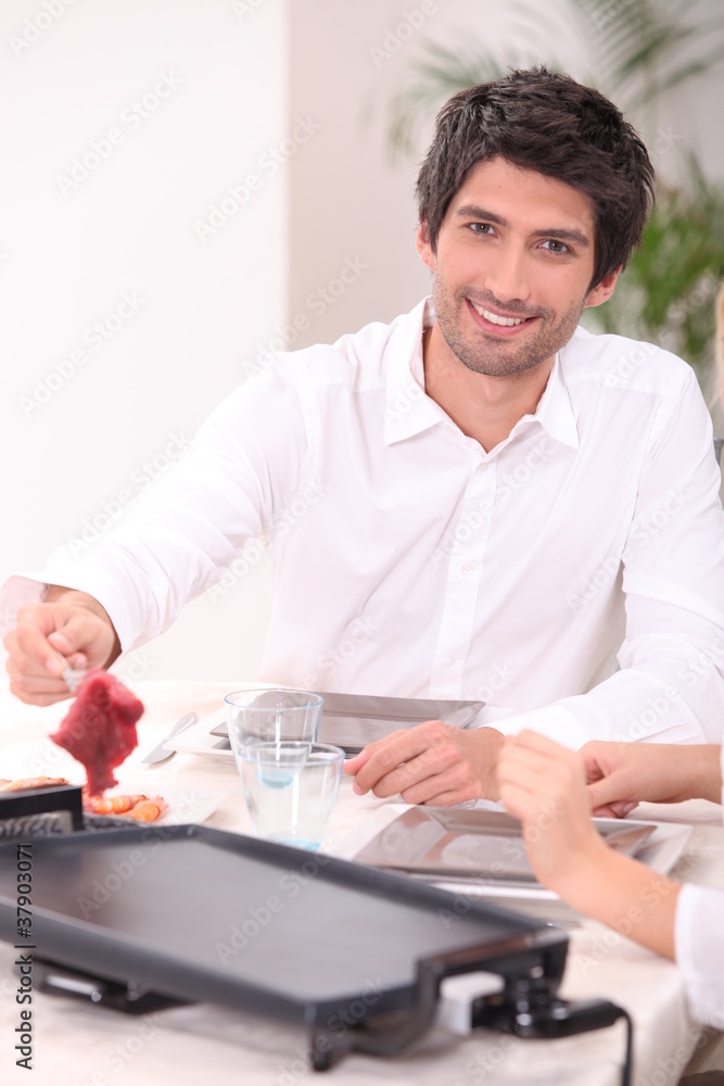 Man grilling meat