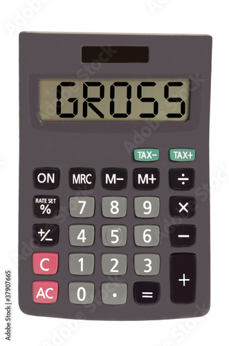 Old calculator on white background showing text "gross"
