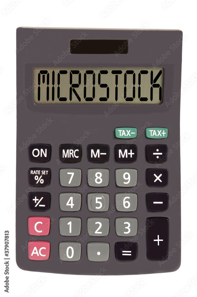 Old calculator on white background showing text Old calculator on white background showing text