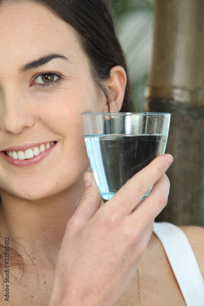 Closeup of a woman with a glass of water