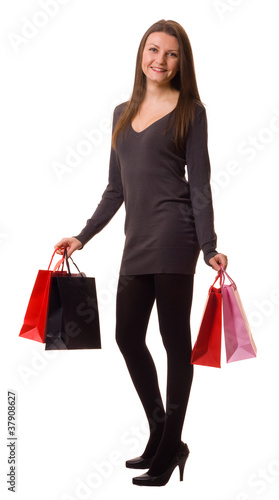 a young woman holding shopping bags
