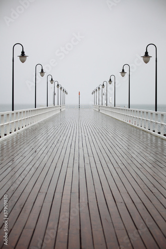 old pier in rain on Baltic sea Orlowo Gdynia Poland #37909830