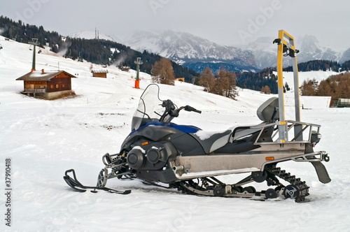 Snowmobile on alps in winter time