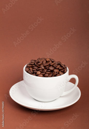 Coffee cup with coffee beans