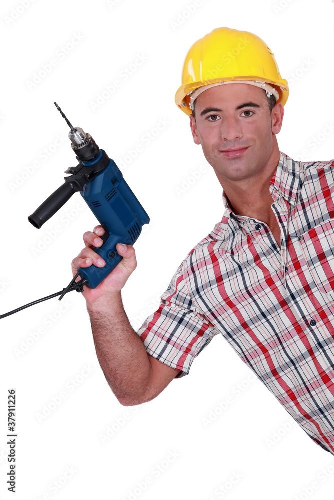 Tradesman holding an electric screwdriver Tradesman holding an electric screwdriver