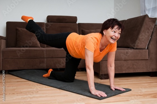 Senior woman exercising at home