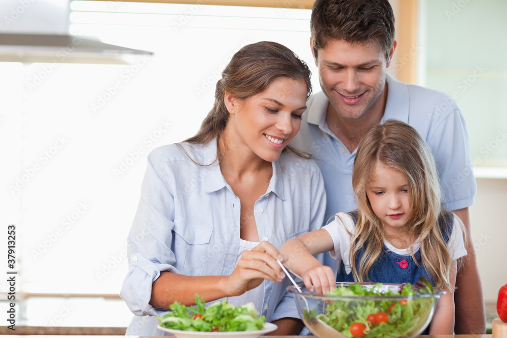 Family preparing a salad Family preparing a salad