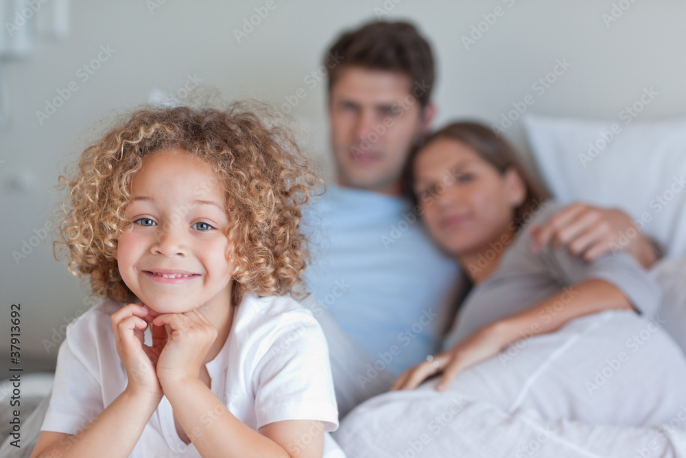 Boy sitting on his parents's bed Boy sitting on his parents's bed
